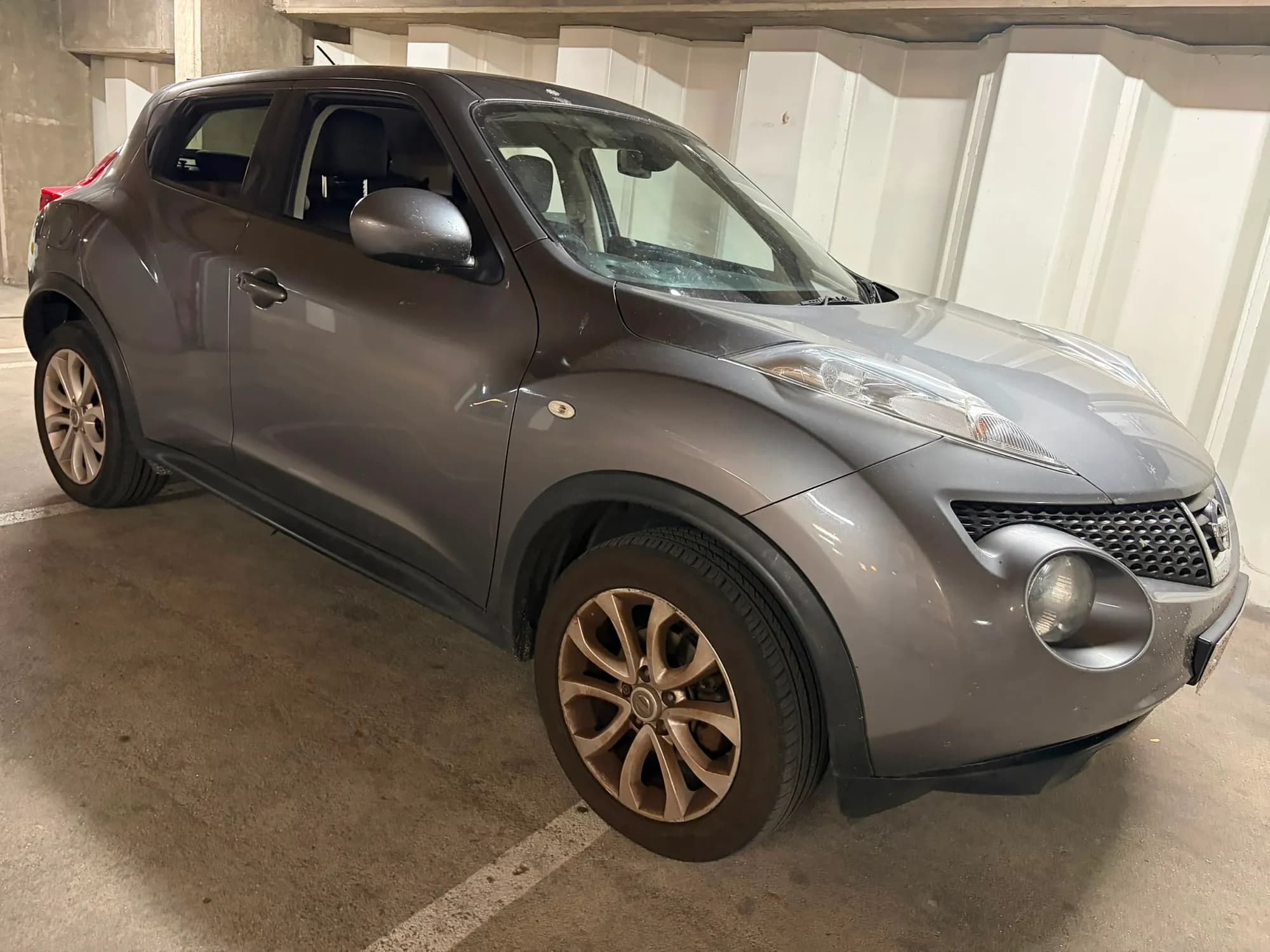 Grey Nissan Juke, front three-quarter view