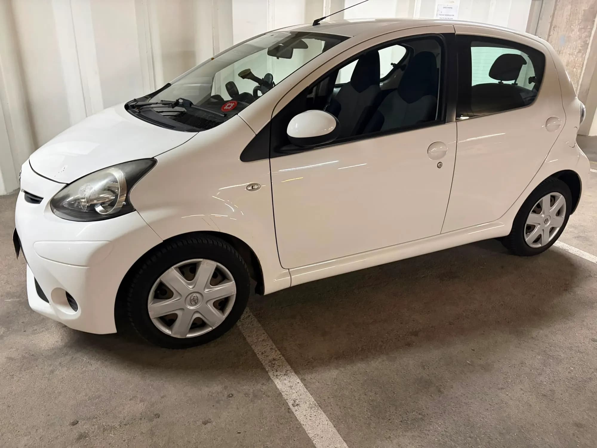 White Toyota Aygo, front three-quarter view